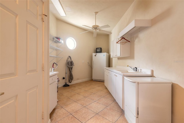 laundry room featuring light tile patterned floors, cabinet space, a sink, and ceiling fan