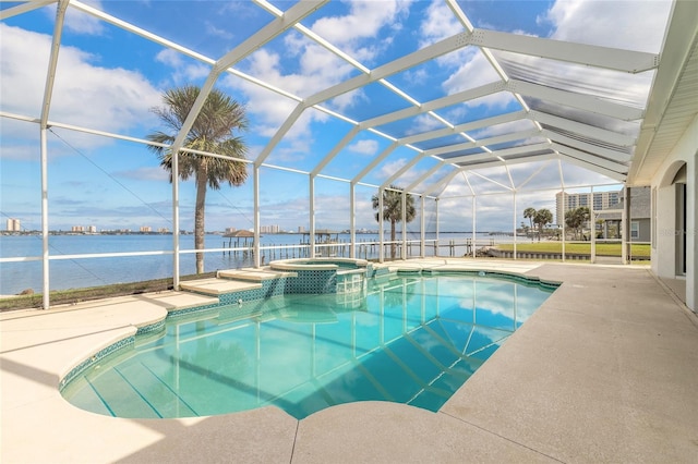 view of swimming pool with a patio, a water view, a lanai, and a pool with connected hot tub