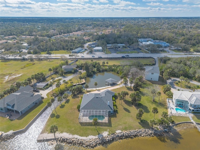 drone / aerial view featuring a water view and a residential view