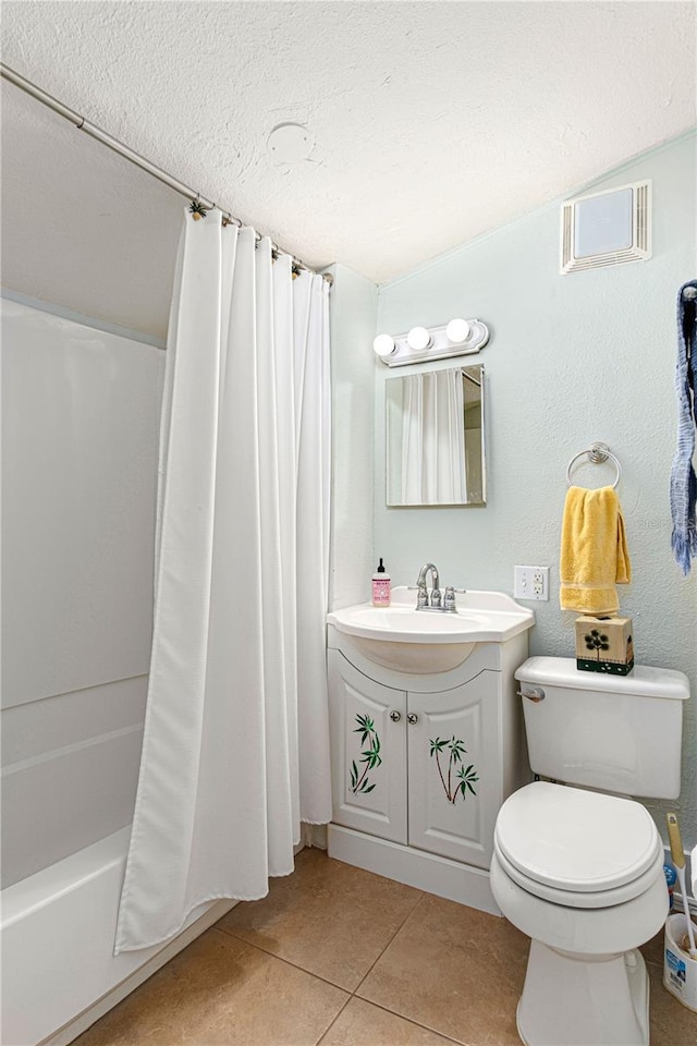 full bathroom with toilet, shower / bath combo with shower curtain, a textured ceiling, vanity, and tile patterned flooring