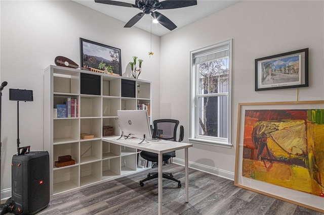 office area with a ceiling fan, baseboards, and wood finished floors