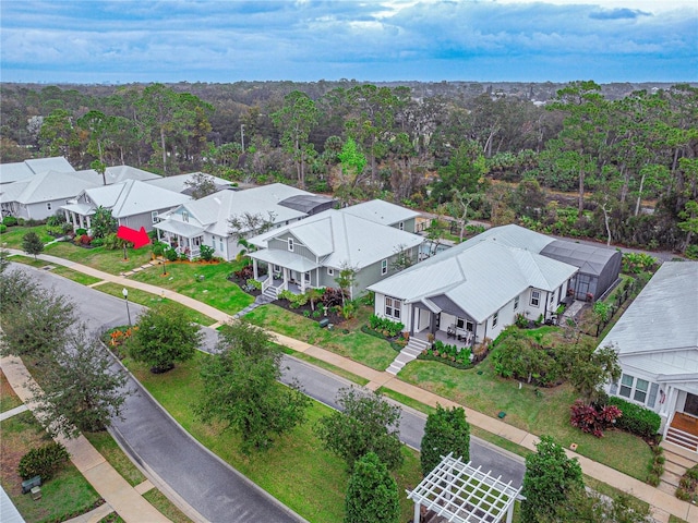 bird's eye view with a residential view and a wooded view