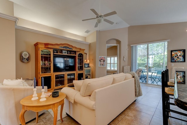 living area featuring lofted ceiling, light tile patterned flooring, visible vents, and a ceiling fan