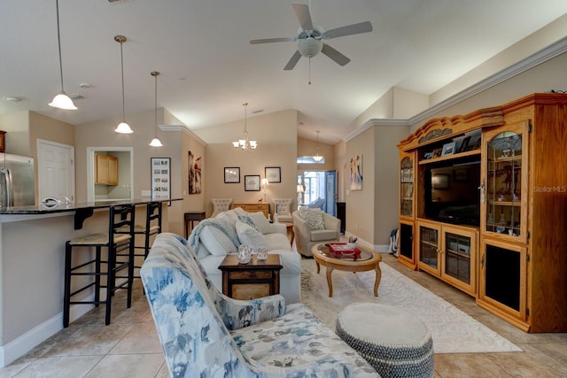 living area featuring lofted ceiling, baseboards, ceiling fan with notable chandelier, and light tile patterned flooring