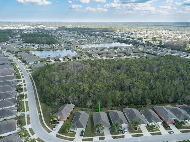 bird's eye view featuring a residential view and a water view