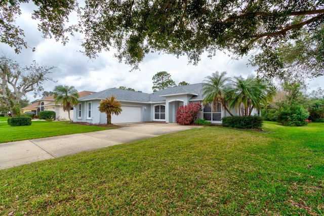 ranch-style home featuring driveway, a front lawn, an attached garage, and stucco siding