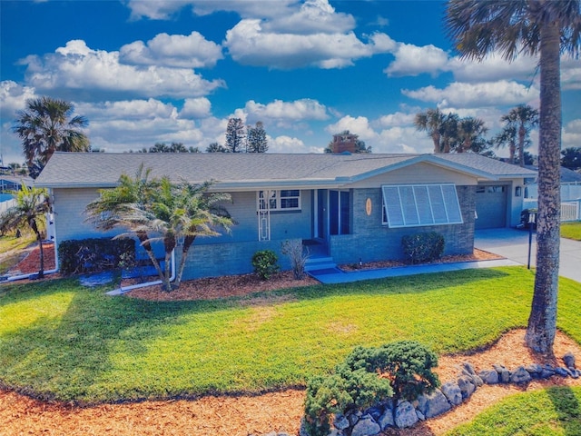 ranch-style home with a front lawn, concrete driveway, and brick siding