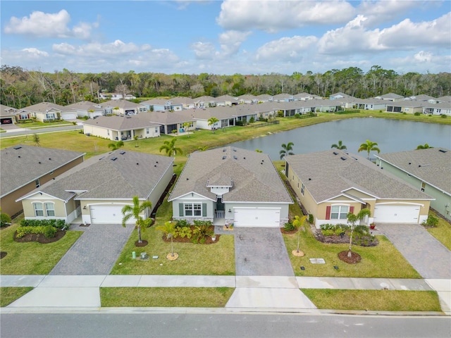 aerial view featuring a water view and a residential view