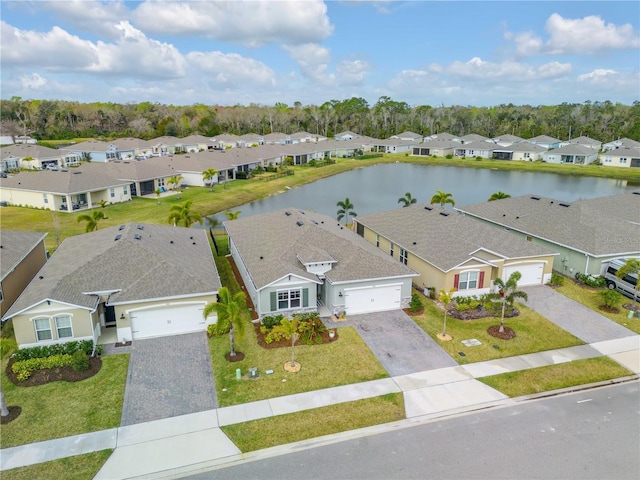 bird's eye view featuring a water view and a residential view