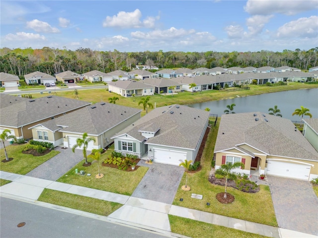 bird's eye view with a water view and a residential view