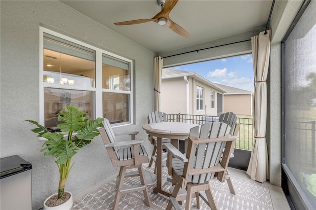 sunroom / solarium with ceiling fan