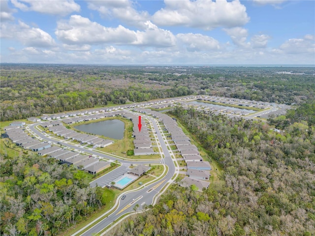 bird's eye view featuring a water view and a view of trees