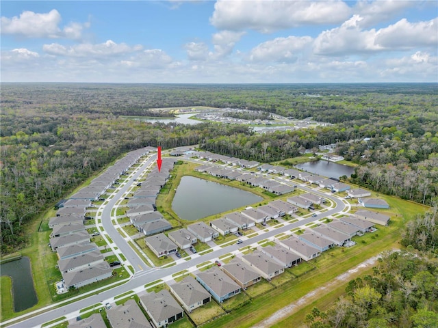 drone / aerial view featuring a water view and a residential view