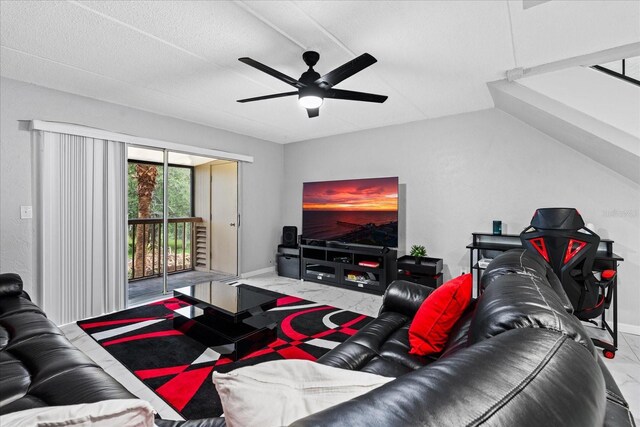 living room with marble finish floor, baseboards, vaulted ceiling, and a ceiling fan