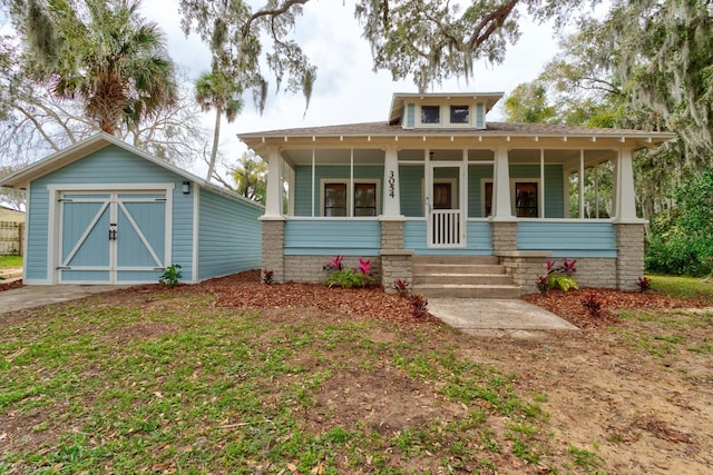 view of front of property with an outbuilding and a porch