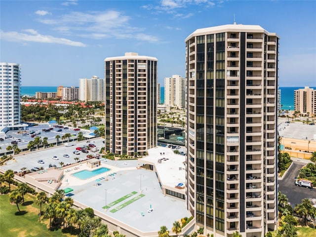 view of property featuring a view of city and a water view