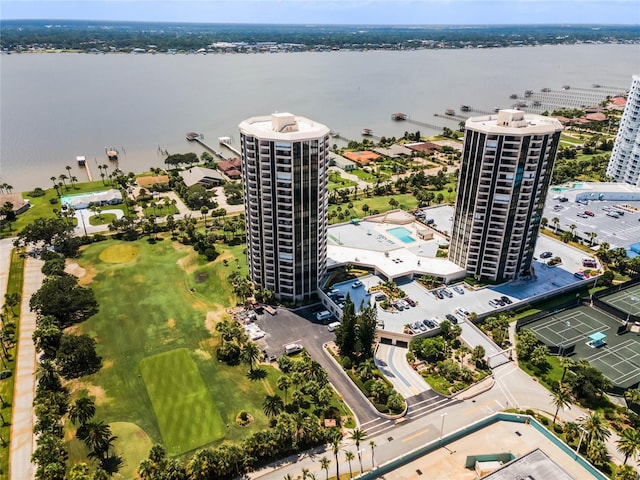 aerial view featuring a view of city, view of golf course, and a water view