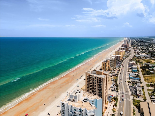 bird's eye view with a water view, a beach view, and a city view