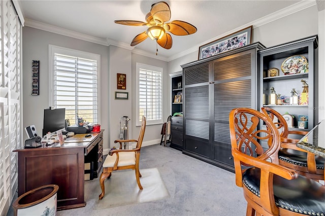 office space with ceiling fan, light carpet, baseboards, and crown molding