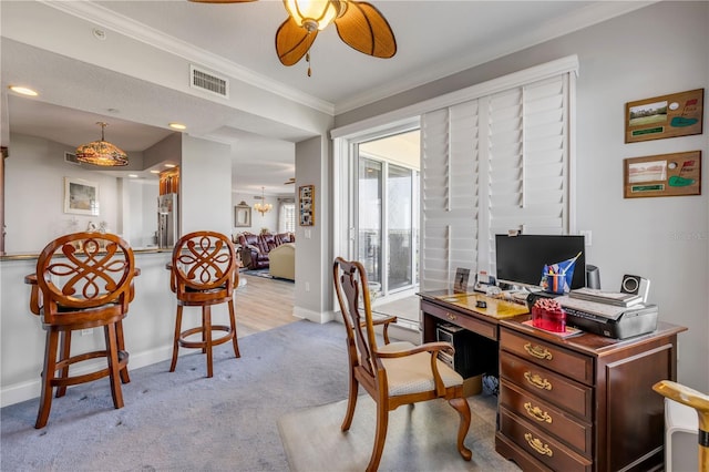 home office with light carpet, baseboards, visible vents, and crown molding