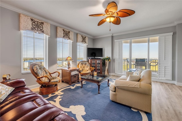 living area featuring ornamental molding and light wood-type flooring