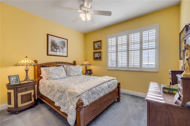 carpeted bedroom featuring ceiling fan and baseboards