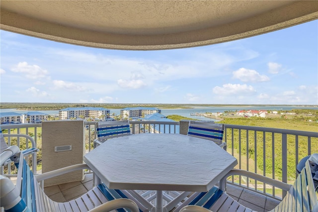 balcony featuring a water view