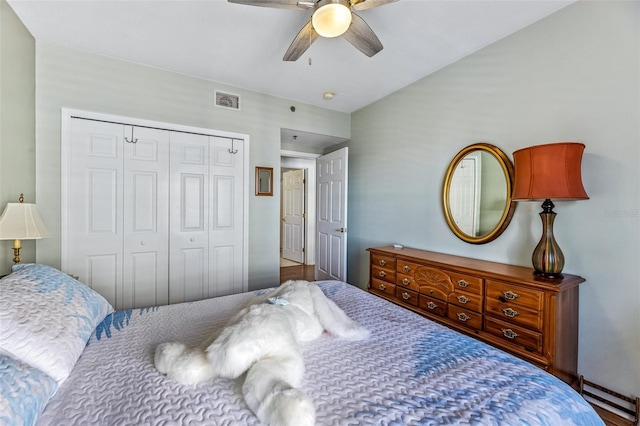 bedroom with a closet, visible vents, and a ceiling fan