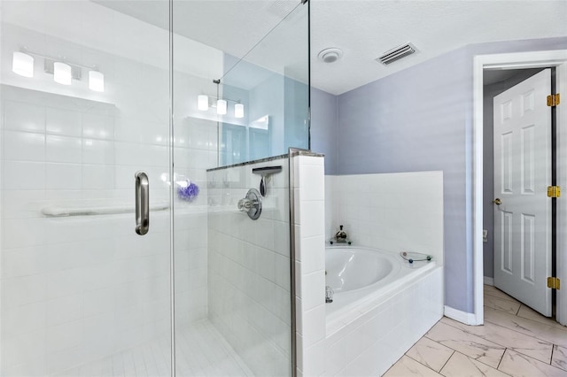 bathroom featuring a garden tub, visible vents, marble finish floor, and a stall shower