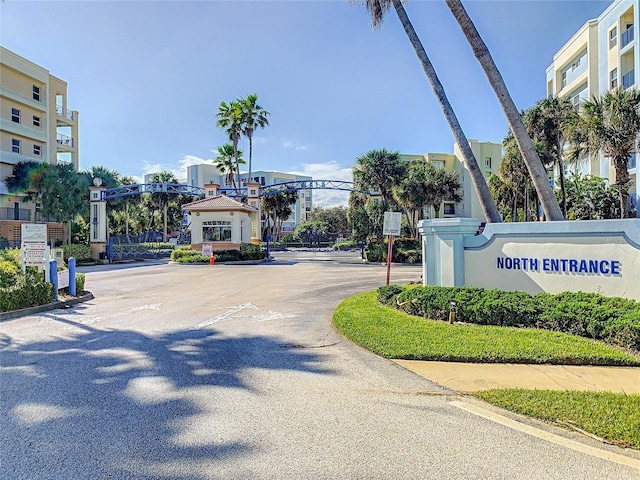 view of road featuring curbs and a gated entry