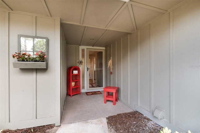 doorway to property featuring board and batten siding