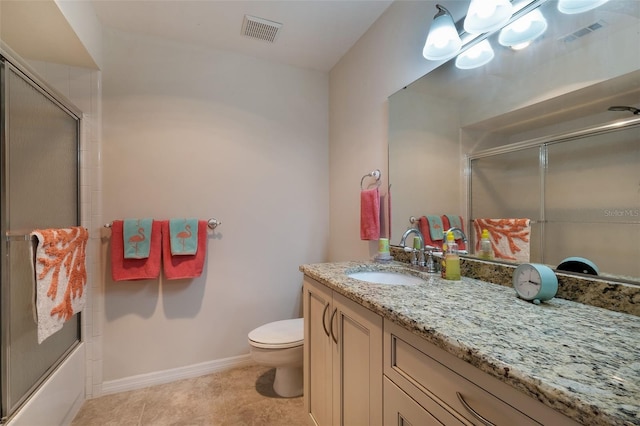 full bathroom featuring toilet, visible vents, bath / shower combo with glass door, and vanity