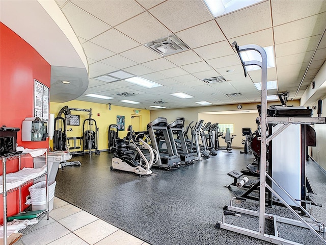 workout area featuring a paneled ceiling and visible vents