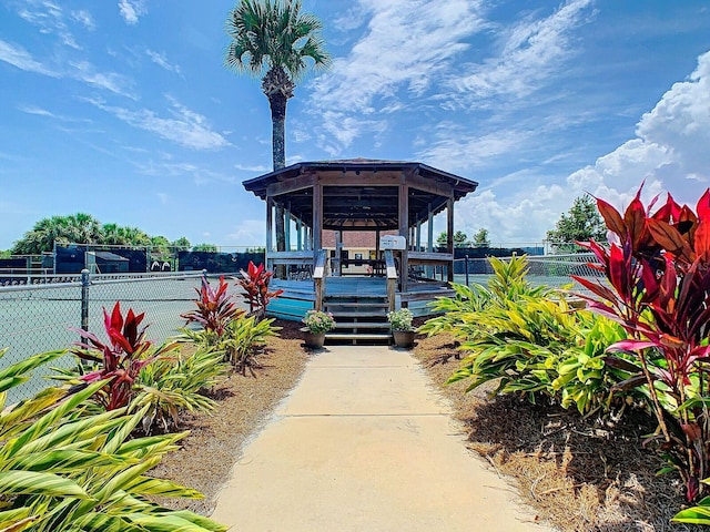 view of community featuring fence