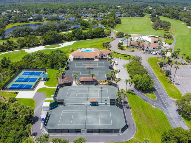 aerial view featuring view of golf course and a water view