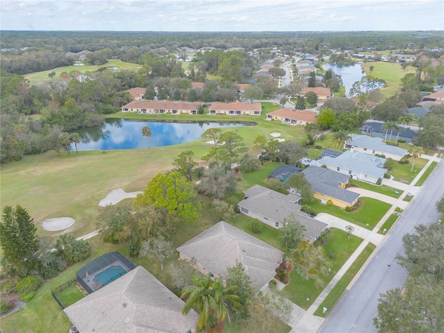 drone / aerial view with a water view and a residential view