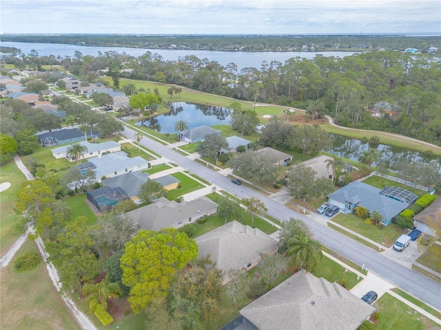 birds eye view of property featuring a residential view and a water view