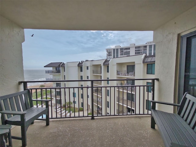 balcony featuring a water view