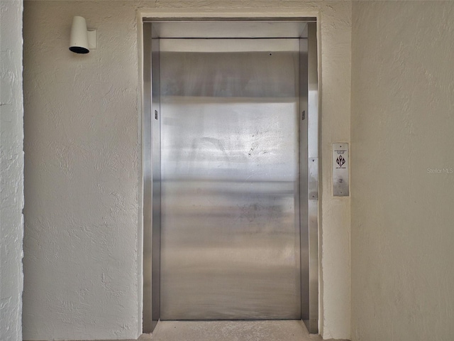 doorway to property featuring elevator