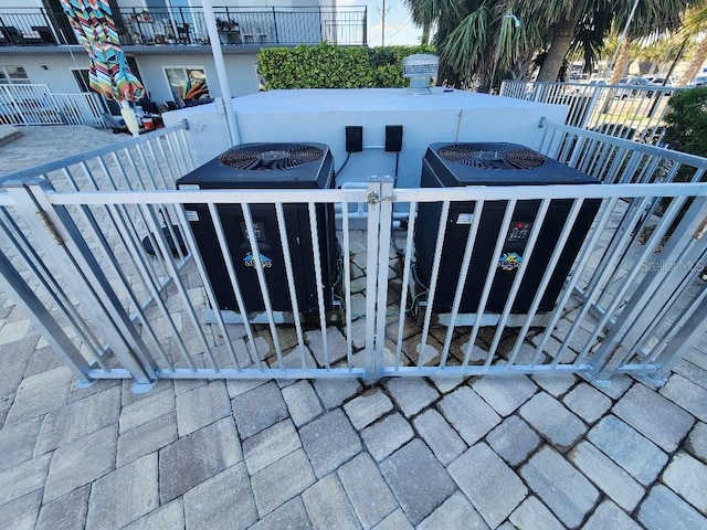 exterior space with fence and central air condition unit