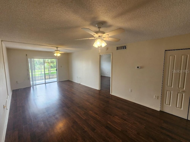 101 N Riverside Dr Unit 2090, New Smyrna Beach, FL 32168 - spare room featuring dark wood finished floors, a textured ceiling, a ceiling fan, and baseboards
