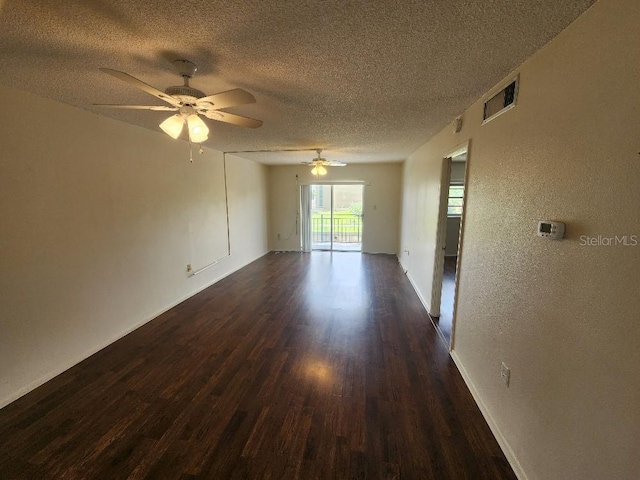 101 N Riverside Dr Unit 2090, New Smyrna Beach, FL 32168 - spare room featuring dark wood finished floors, a textured ceiling, a textured wall, a ceiling fan, and baseboards