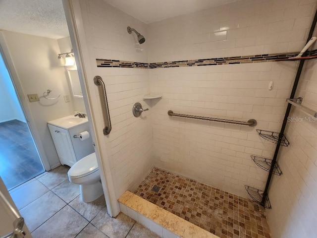 101 N Riverside Dr Unit 2090, New Smyrna Beach, FL 32168 - bathroom featuring a shower stall, vanity, toilet, and tile patterned floors