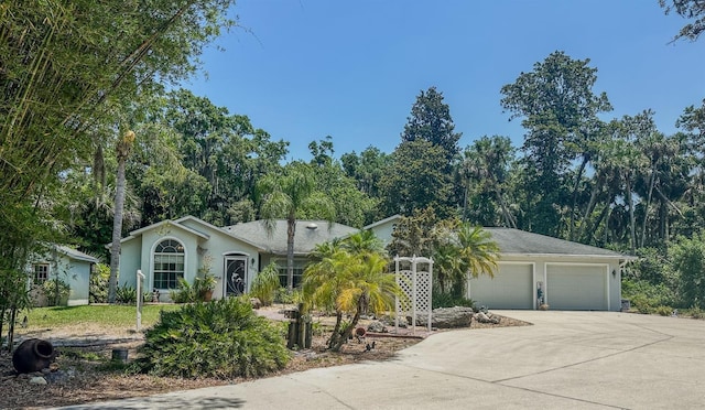 2576 Shilo Glynn Ln, New Smyrna Beach, FL 32168 - ranch-style home featuring a garage, concrete driveway, and stucco siding