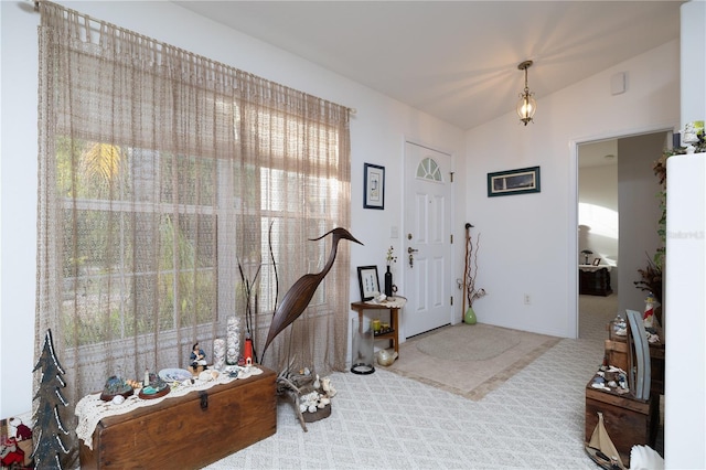 2576 Shilo Glynn Ln, New Smyrna Beach, FL 32168 - carpeted foyer entrance featuring lofted ceiling