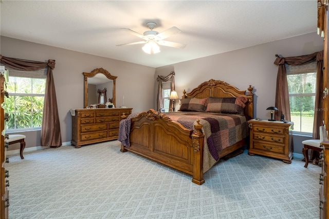 2576 Shilo Glynn Ln, New Smyrna Beach, FL 32168 - bedroom featuring light colored carpet, a ceiling fan, and baseboards
