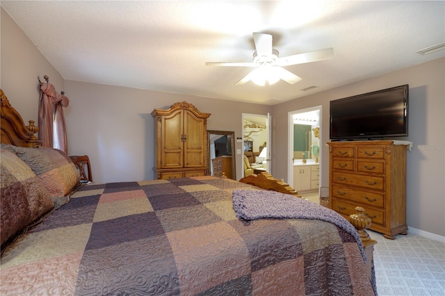 2576 Shilo Glynn Ln, New Smyrna Beach, FL 32168 - bedroom featuring light carpet, a ceiling fan, and connected bathroom
