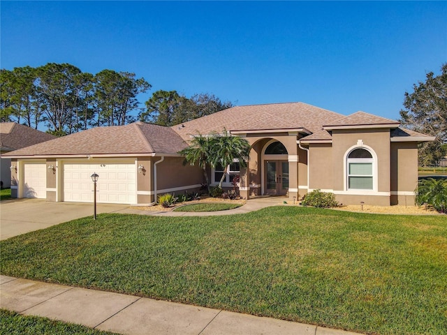 6456 Cypress Springs Pkwy, Port Orange, FL 32128 - mediterranean / spanish-style house with concrete driveway, a front yard, stucco siding, french doors, and a garage