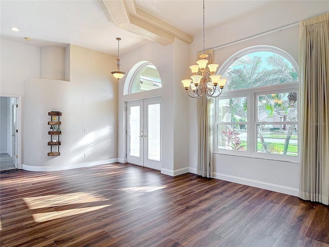 6456 Cypress Springs Pkwy, Port Orange, FL 32128 - foyer entrance with dark wood finished floors, french doors, a high ceiling, baseboards, and a chandelier