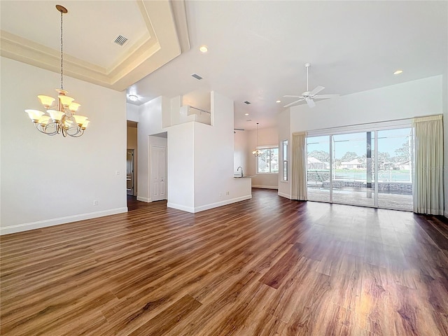 6456 Cypress Springs Pkwy, Port Orange, FL 32128 - unfurnished living room featuring visible vents, ceiling fan with notable chandelier, dark wood-type flooring, and baseboards
